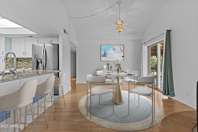 2916 S Revere Cir, Mesa, AZ 85210 - dining space featuring light wood finished floors, ceiling fan, and baseboards