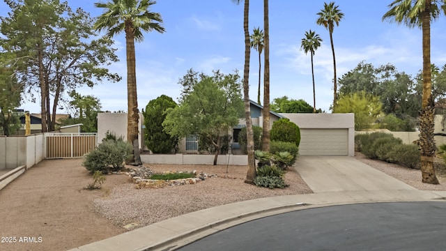 2916 S Revere Cir, Mesa, AZ 85210 - view of front facade featuring concrete driveway, a gate, and stucco siding