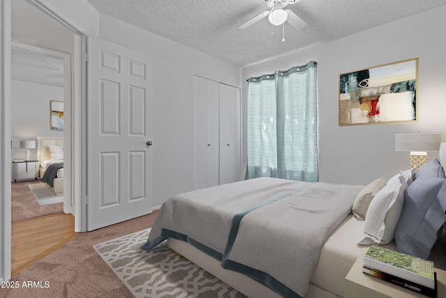 2916 S Revere Cir, Mesa, AZ 85210 - carpeted bedroom featuring a textured ceiling, a closet, and a ceiling fan
