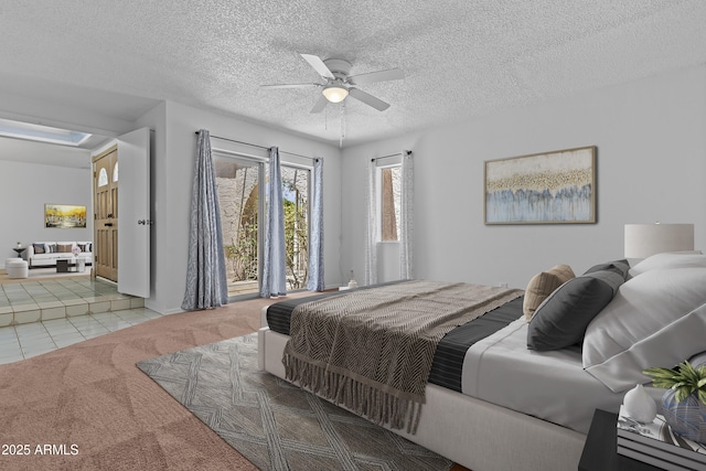 2916 S Revere Cir, Mesa, AZ 85210 - bedroom with carpet, tile patterned floors, a ceiling fan, baseboards, and a textured ceiling