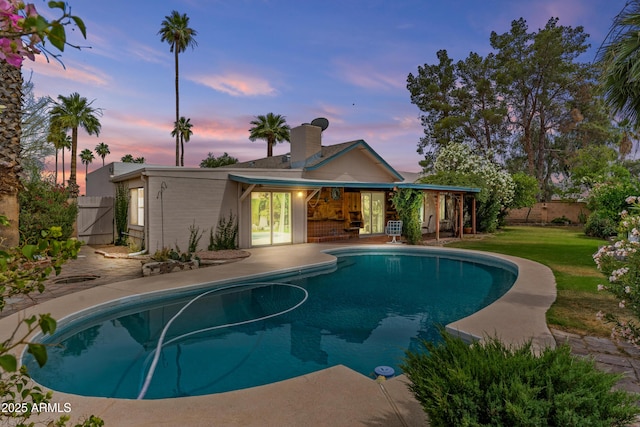 2916 S Revere Cir, Mesa, AZ 85210 - pool at dusk featuring a patio, an outdoor pool, and a gate