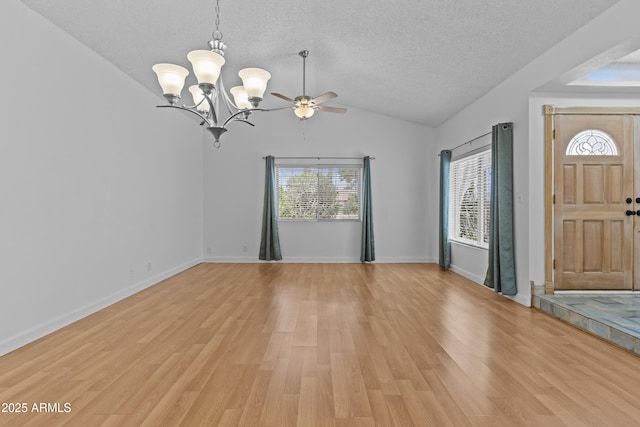 2916 S Revere Cir, Mesa, AZ 85210 - foyer featuring a textured ceiling, a chandelier, healthy amount of natural light, lofted ceiling, and light wood-style flooring