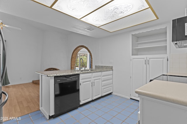 2916 S Revere Cir, Mesa, AZ 85210 - kitchen with black dishwasher, a sink, white cabinetry, a peninsula, and a ceiling fan