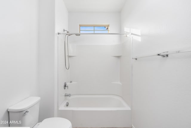 bathroom with toilet and shower / tub combination