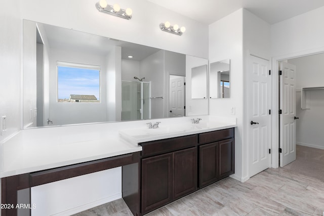 bathroom featuring vanity and walk in shower