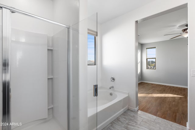 bathroom featuring plus walk in shower, tile patterned floors, and ceiling fan