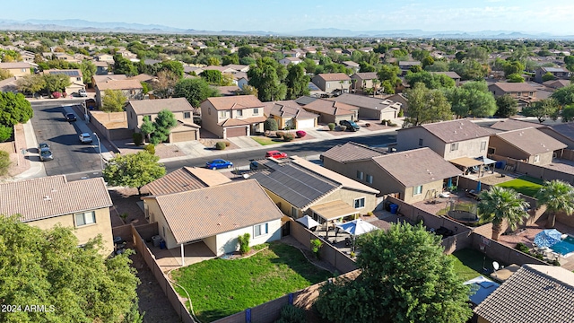 birds eye view of property with a mountain view