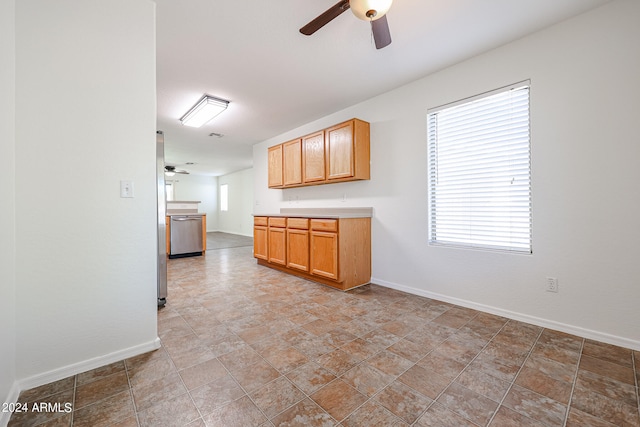 kitchen featuring stainless steel dishwasher and ceiling fan