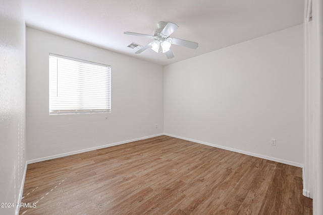 spare room with ceiling fan and light hardwood / wood-style floors