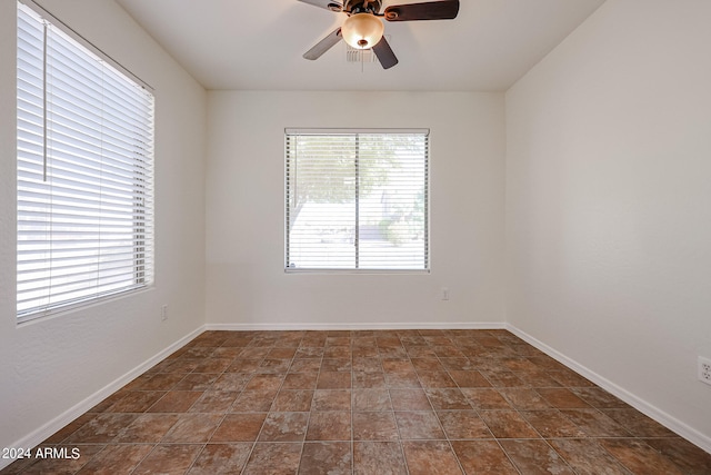 unfurnished room featuring ceiling fan