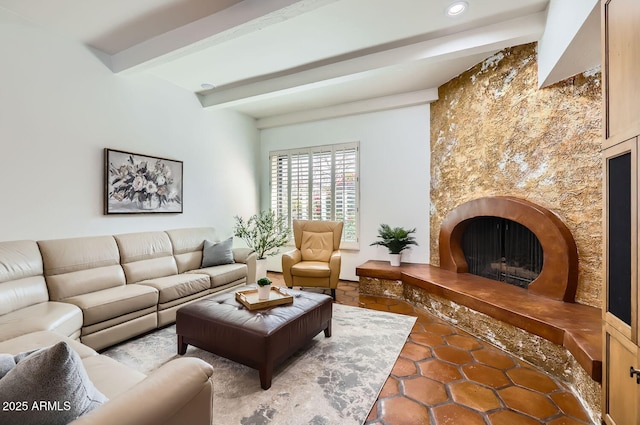 living room featuring a premium fireplace and beam ceiling