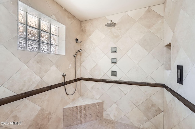 bathroom featuring a tile shower