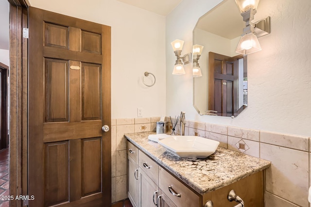 bathroom featuring tile walls and vanity