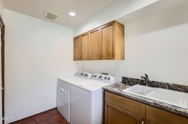 laundry room with separate washer and dryer, sink, and cabinets