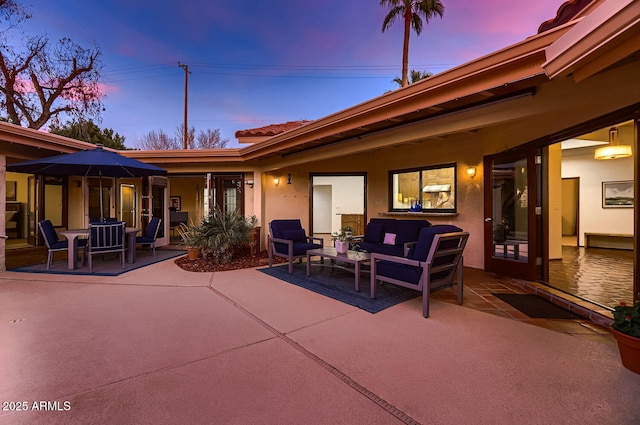 patio terrace at dusk with outdoor lounge area