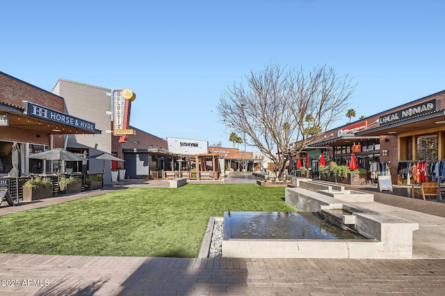 view of community featuring a lawn