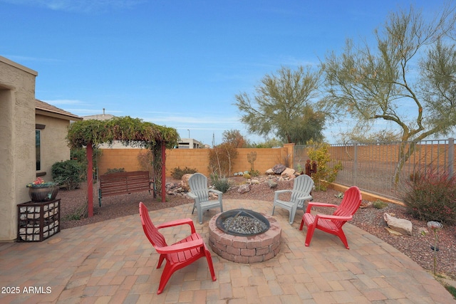 view of patio with a fire pit