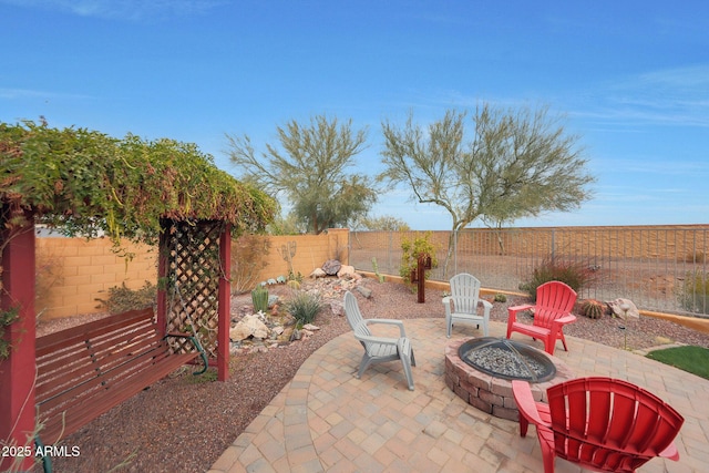 view of patio / terrace featuring a fire pit