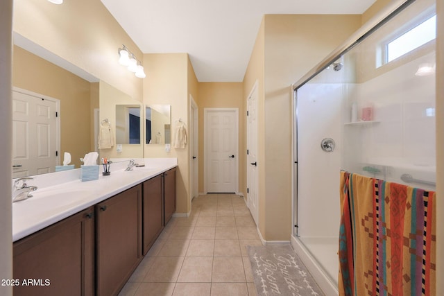 bathroom featuring an enclosed shower, vanity, and tile patterned floors