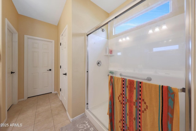 bathroom featuring walk in shower and tile patterned floors