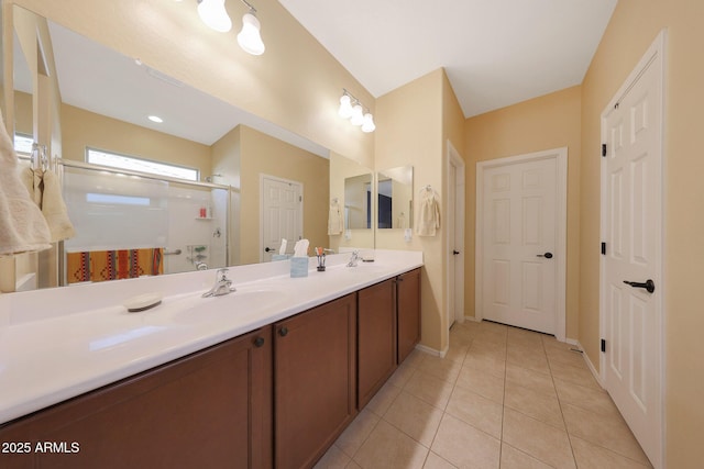 bathroom with vanity, tile patterned flooring, and a shower with door