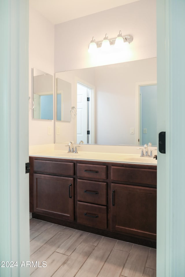 bathroom featuring hardwood / wood-style floors and vanity