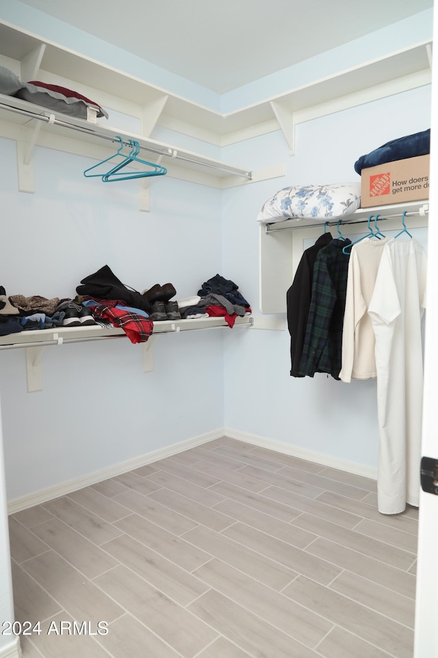 spacious closet featuring light wood-type flooring