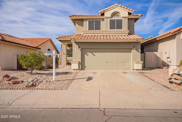 mediterranean / spanish-style home with a garage