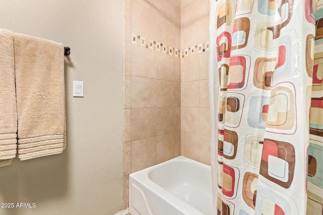 bathroom featuring shower / bath combination with curtain