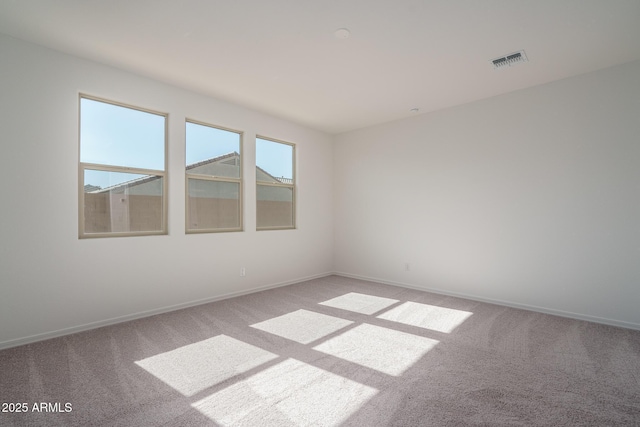 empty room featuring light colored carpet