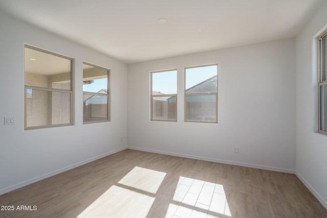 unfurnished room featuring light hardwood / wood-style floors