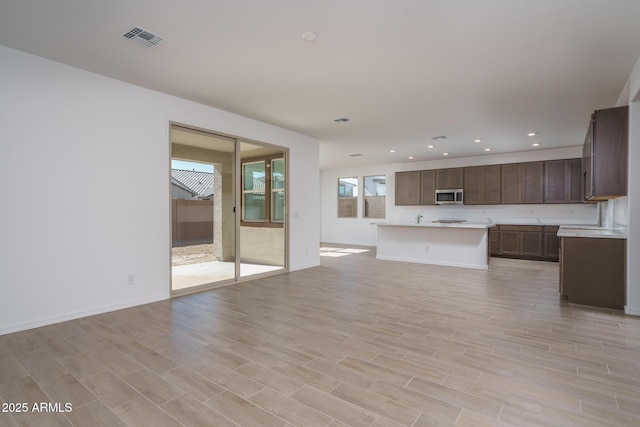 unfurnished living room with light hardwood / wood-style floors