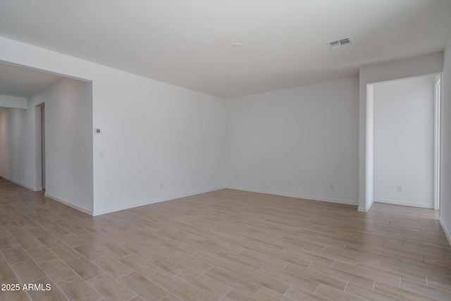 unfurnished room with light wood-type flooring