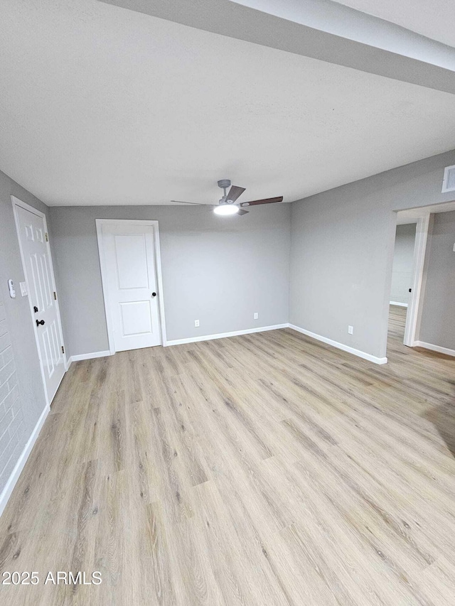 4520 N 28th Dr, Phoenix, AZ 85017 - unfurnished living room with baseboards, light wood-style floors, and ceiling fan