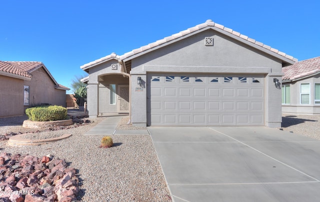 ranch-style home featuring a garage