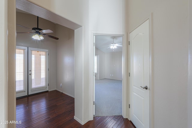 entrance foyer with ceiling fan, dark wood-type flooring, lofted ceiling, and french doors