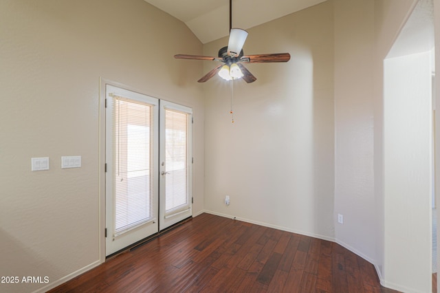 unfurnished room featuring ceiling fan, dark hardwood / wood-style floors, lofted ceiling, and french doors