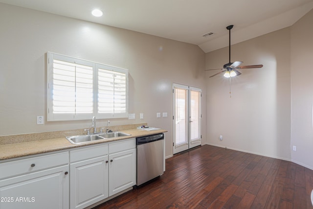 kitchen with white cabinetry, stainless steel dishwasher, sink, vaulted ceiling, and dark hardwood / wood-style floors