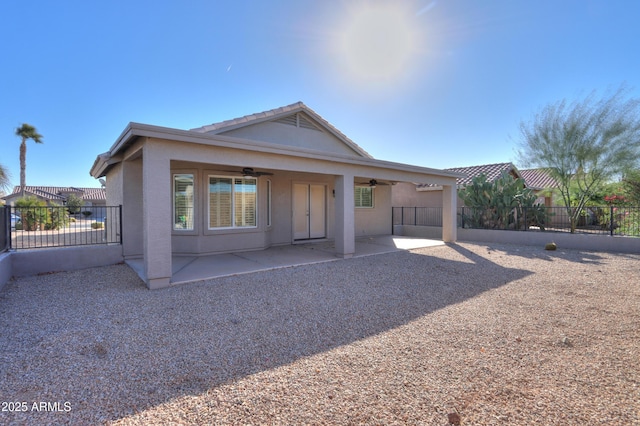 rear view of house with a patio and ceiling fan