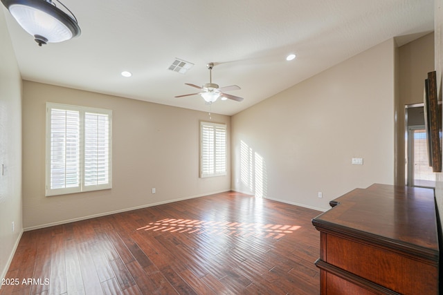 interior space featuring ceiling fan, plenty of natural light, and dark hardwood / wood-style flooring