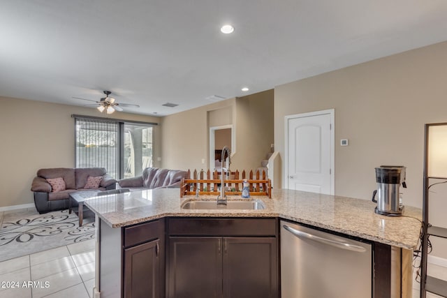 kitchen featuring stainless steel dishwasher, dark brown cabinets, ceiling fan, sink, and light tile patterned flooring