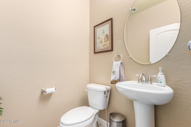 bathroom featuring sink and toilet