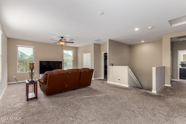 living room with carpet flooring and ceiling fan