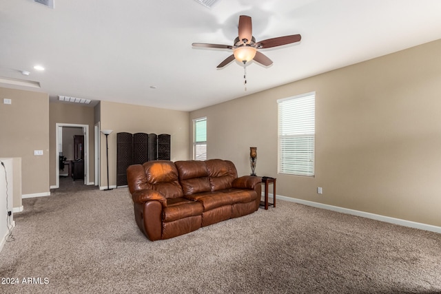 living room featuring carpet floors and ceiling fan