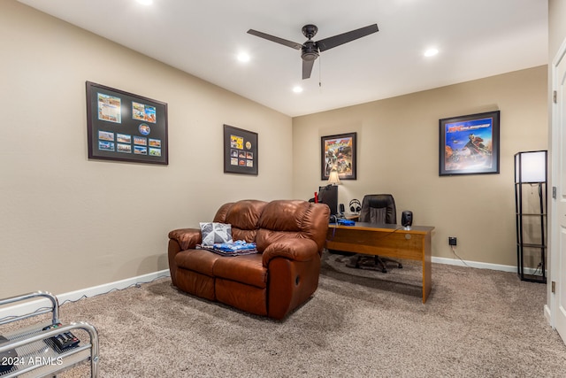 carpeted home office featuring ceiling fan