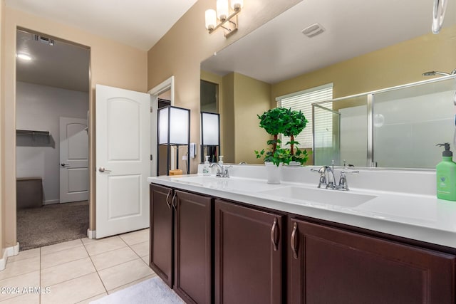33242 N Jamie Ln, San Tan Valley, AZ 85144 - bathroom with double vanity, a shower stall, and tile patterned floors