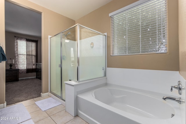 bathroom with tile patterned flooring and plus walk in shower