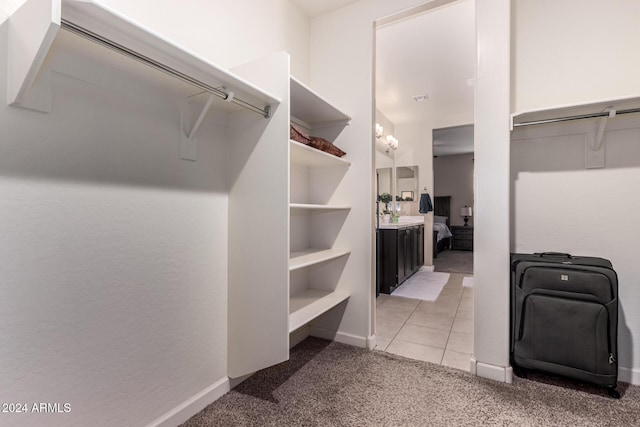 33242 N Jamie Ln, San Tan Valley, AZ 85144 - spacious closet featuring light carpet and light tile patterned flooring