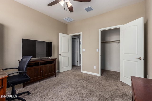 carpeted office space with ceiling fan