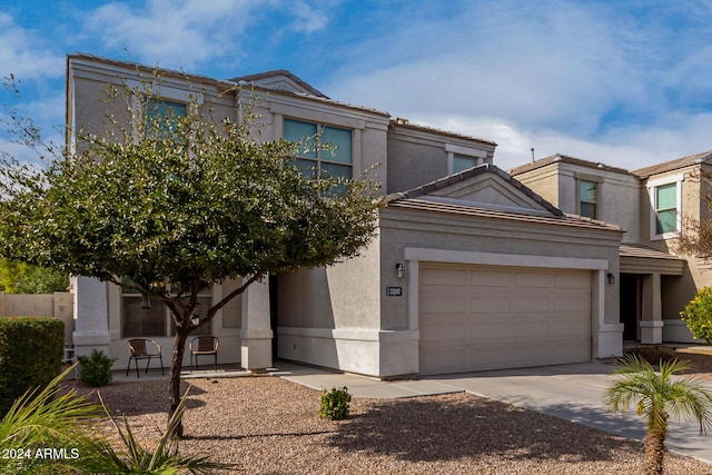 33242 N Jamie Ln, San Tan Valley, AZ 85144 - view of front of property with stucco siding, concrete driveway, a tiled roof, and a garage